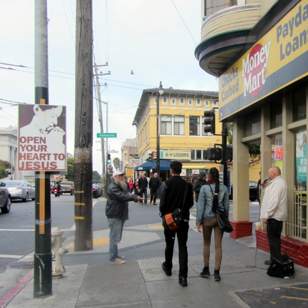 BRANDON PREACHES AS NORM PASSES OUT TRACTS ON VALENCIA STREET SF